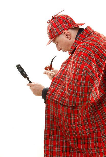 istock Detective Sherlock Holmes investigate with magnifying glass 137056177