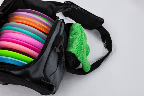 istock Bag of Disc Golf Flying Discs on Snow 1370561772