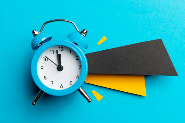 istock Blue Alarm Clock and Papers 1370564233