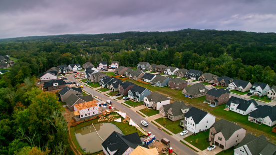 Aerial view from above heavily-wooded tract housing in the community of Ooletewah on the edge of Chattanooga in Hamilton County, Tennessee.