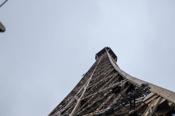 istock Old metal massive structure in Paris France from a different perspective on a bright white background 1370568564