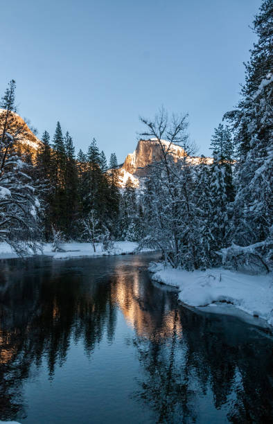 istock Sunset at Half dome reflected in the merced rivier 1370569003