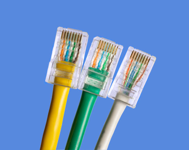 istock multicolored twisted pair cables with RJ45 on a blue background 1370569889