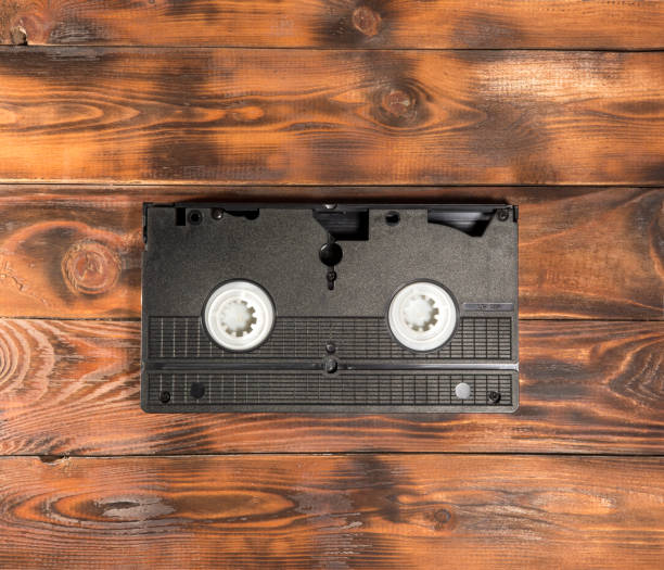 istock black videotape on a wooden background. copy space. 1370569933