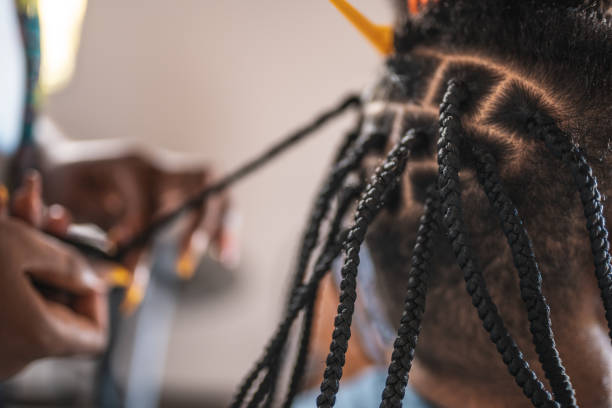 istock Hairdresser preparing braids 1370569973
