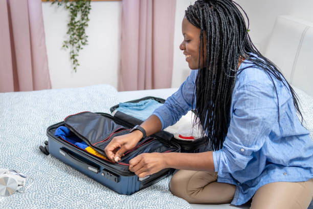 istock Woman packing the suitcase 1370570922