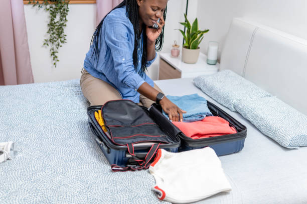 istock Woman packing the suitcase 1370571128