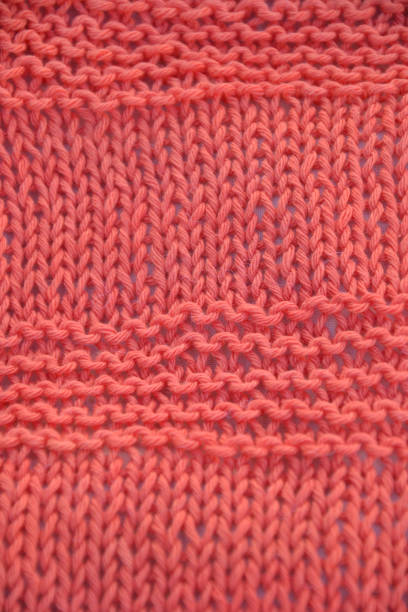 istock coral color two needle knitting 1370571141
