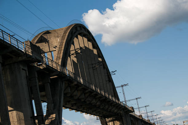 istock Arched railway bridge across the river in summer. Merefo-Kherson old bridge over the Dnieper river. Dnepropetrovsk, Ukraine 1370571231
