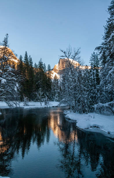 istock Sunset at Half dome reflected in the merced rivier 1370571453