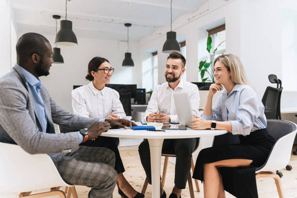 istock Multi-ethnic business people during meeting in modern office 1370572138