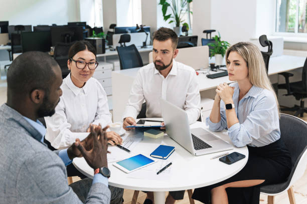 istock Multi-ethnic business people during meeting in modern office 1370572150