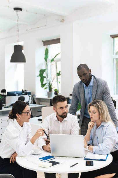istock Multi-ethnic business people during meeting in modern office 1370572192