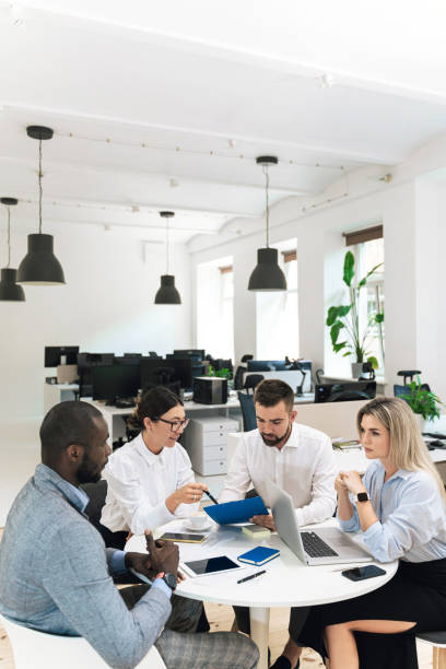 istock Multi-ethnic business people during meeting in modern office 1370572412