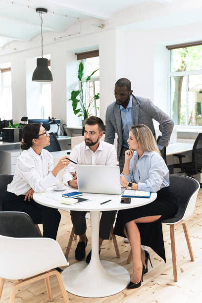 istock Multi-ethnic business people during meeting in modern office 1370572458