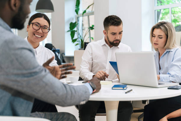 istock Multi-ethnic business people during meeting in modern office 1370572516