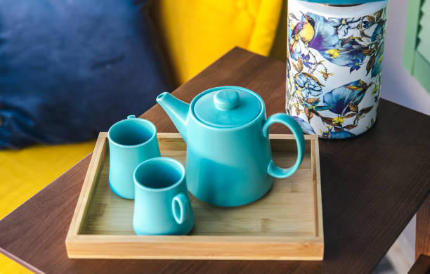 istock Teapot and two blue cups on the table, top view. 1370573264