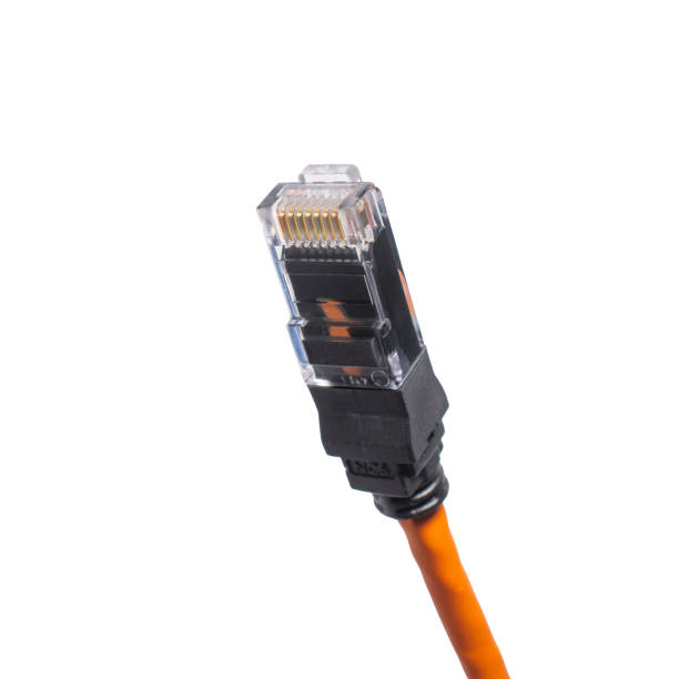 istock orange twisted pair with black RJ45 jack isolated on white 1370574335