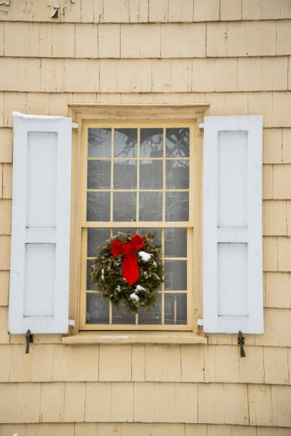 istock Christmas wreath on a window 1370574624