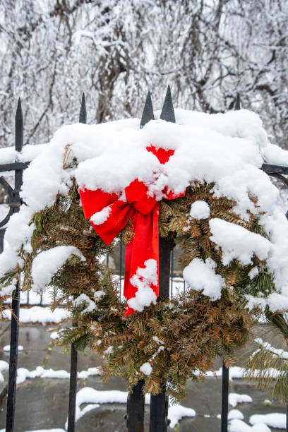 istock A Christmas wreath covered in snow 1370574648