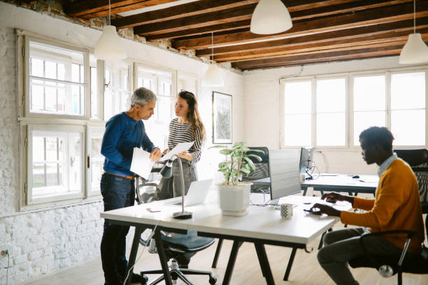 istock group of IT professionals working in the Berlin office 1370575765