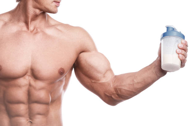 istock Muscular bodybuilder with a shaker full of whey protein 1370575882