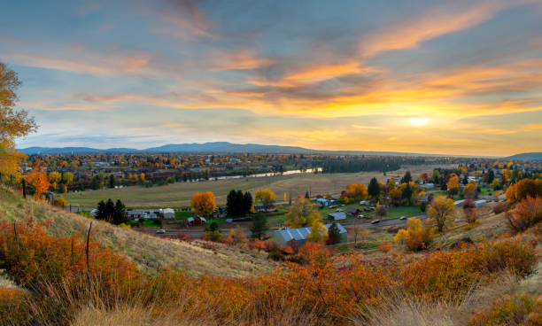 Panoramic hillside view over Spokane Valley looking towards downtown Spokane, Washington, as the sun sets on an Autumn day with fall colors. Panoramic hillside view over Spokane Valley looking towards downtown Spokane, Washington, as the sun sets on an Autumn day with fall colors. spokane river stock pictures, royalty-free photos & images