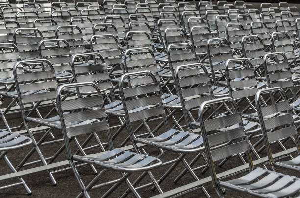 istock Background of various rows of metal chairs 1370580891