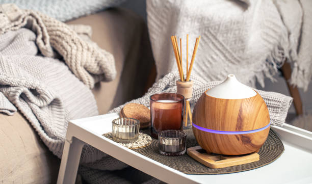 istock A cozy composition with an aroma diffuser and candles in a home interior. 1370582391