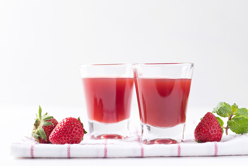 Strawberry juice in glass with fresh strawberry fruit on white background, Healthy drink