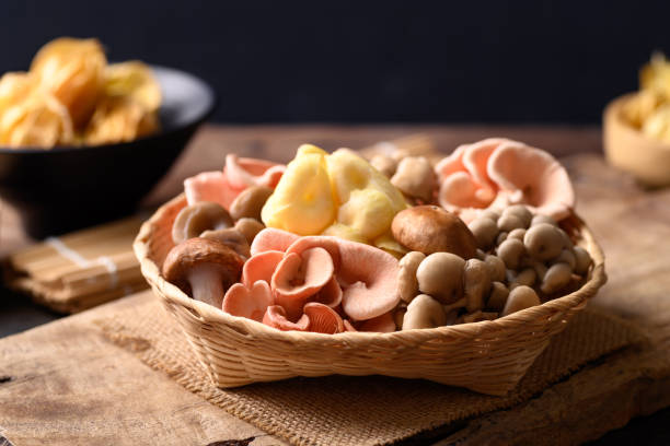 istock Mixed fresh mushroom (Edible mushroom) in bamboo basket 1370584702