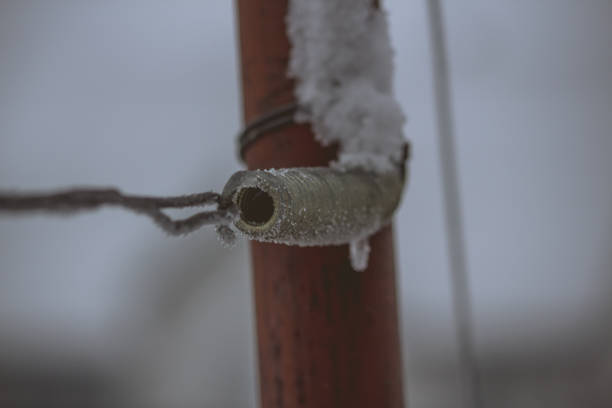 Metal spring frozen during winter snowfall