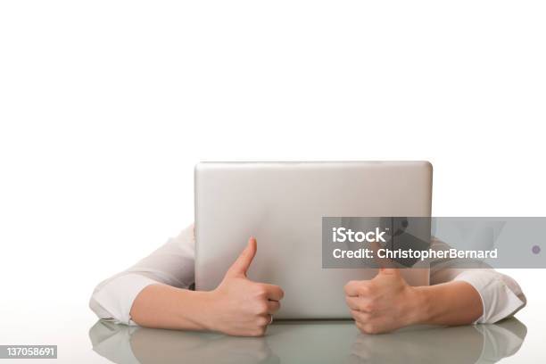 Businesswoman Hiding Behind Her Computer With Thumbs Up Stock Photo - Download Image Now