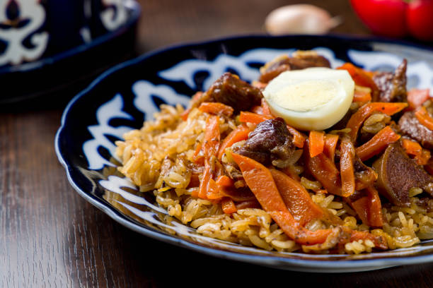 istock pilaf with beef, carrots and egg on wooden table macro close up 1370587304
