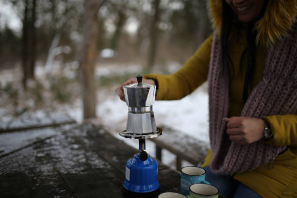 istock Frineds drinking hot drinks on snow stock photo 1370588938