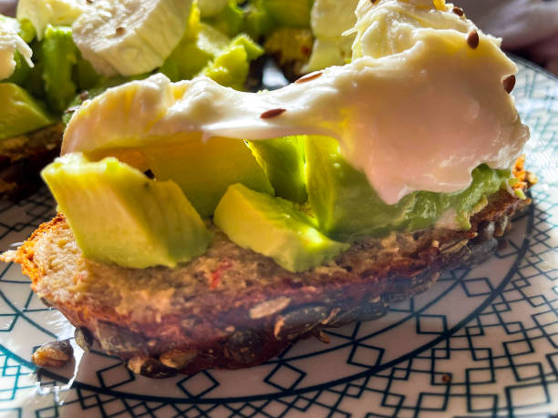 Homemade sandwiches with hummus, avocado and mozzarella stock photo