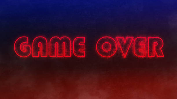 neon text game over on black concrete wall stock photo