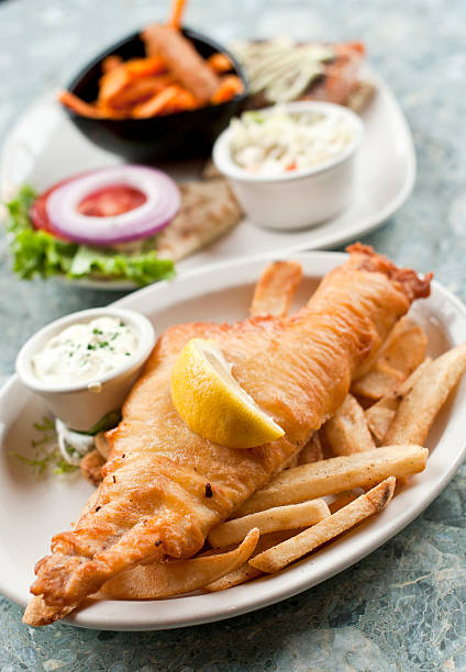 istock A plate of fish and chips with side salad 137059062