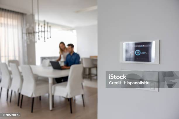 Closeup On A Controller At A Smart Home Stock Photo - Download Image Now - Burglar Alarm, Fire Alarm, Alarm