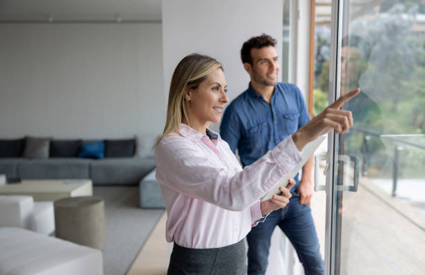 istock Real estate agent showing a house to a man 1370591106