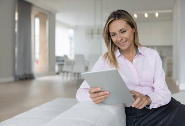 istock Business woman working at home using a tablet computer 1370591119