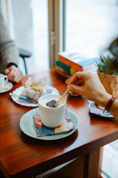 istock People relaxing in the cafe 1370591387