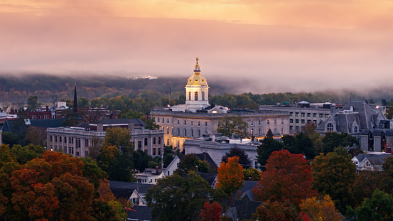 Aerial shot of the New Hampshire State House in Concord at sunrise on a misty morning in Fall.  

Authorization was obtained from the FAA for this operation in restricted airspace.
