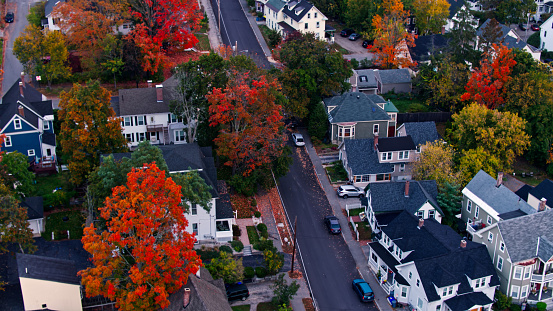 Aerial shots of houses in Concord at sunrise on a misty morning in Fall.  

Authorization was obtained from the FAA for this operation in restricted airspace.