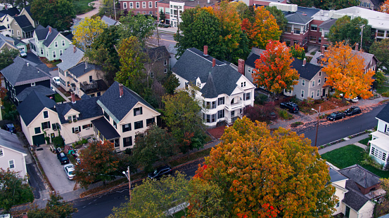 Aerial shots of houses in Concord at sunrise on a misty morning in Fall.  

Authorization was obtained from the FAA for this operation in restricted airspace.