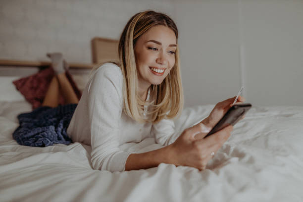 istock Young woman using her smartphone 1370594287