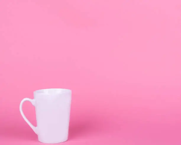 White ceramic mug on pink background, Valentine's day concept, Rest, relax, mother's and Mothers day Mockup.