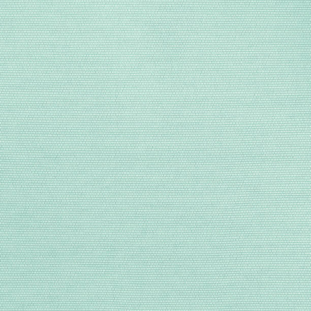 istock Cotton linen fabric textile woven textured backdrop in pastel light green blue mint color 1370595242