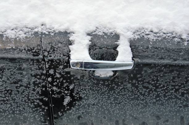 istock door with car handle frozen in winter 1370595473