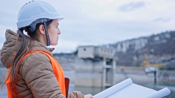 istock Female engineer working in hydroelectric dam. Ecology orientated. Renewable energy systems. 1370595579